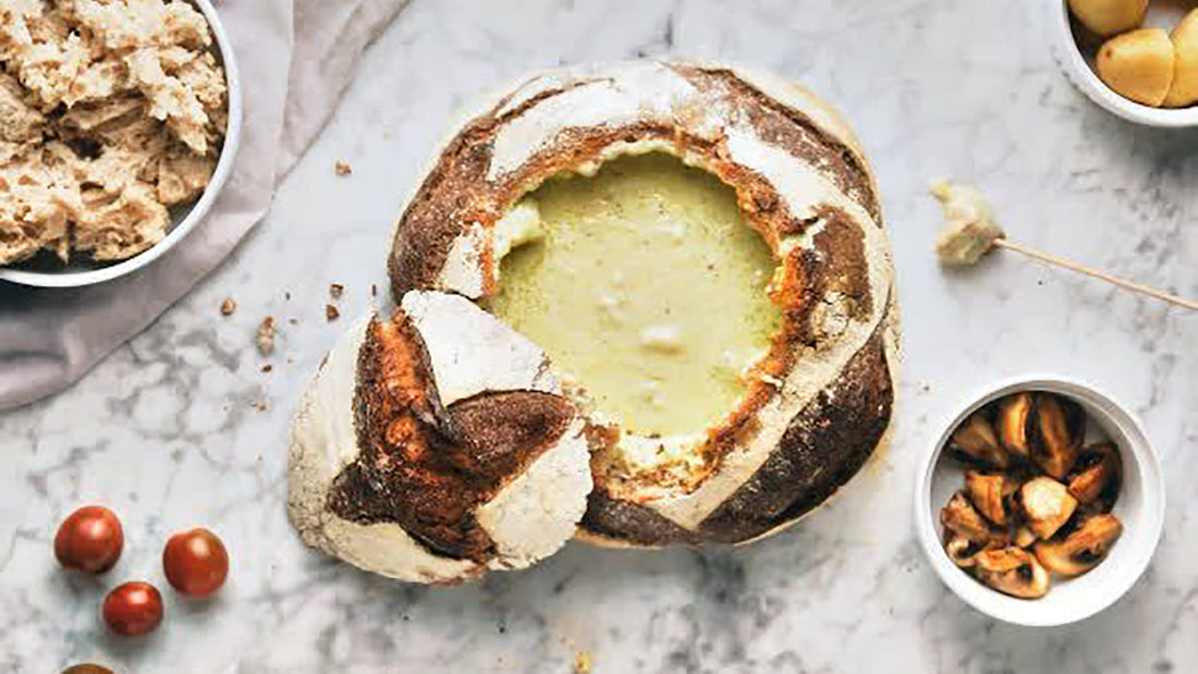 Cheese fondue in a loaf of bread