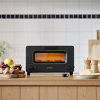 BALMUDA Toster | Toster parowy | 5 trybów gotowania: chleb kanapkowy, chleb rzemieślniczy, pizza i ciastka, piekarnik | Precyzyjna kontrola ciepła | Technologia parowa | Blacha do pieczenia | Wersja amerykańska | Czarny