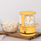 Presto 05206 Showtime Gourmet Oil Popcorn Popper - 9 filiżanek, wbudowana miska do serwowania, kompaktowa konstrukcja, ceramiczna powłoka zapobiegająca przywieraniu, bez PFAS, żółty