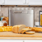 2-pound stainless steel bread maker with 25 intelligent cooking programs, including accessories and measuring cups
